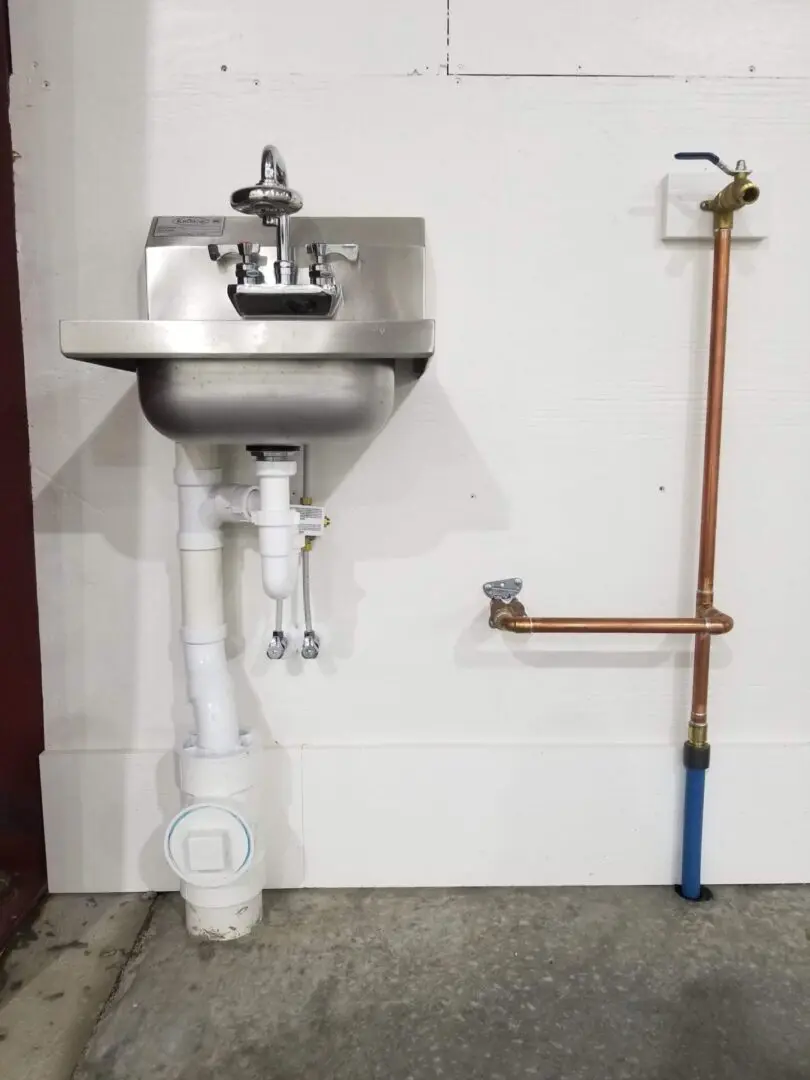 A sink and a water plumbing system