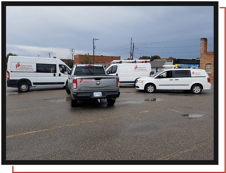 Scholtens Plumbing Inc. vehicles in parking area