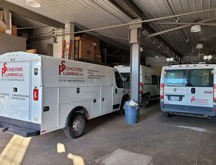 Scholtens Plumbing Inc. vehicles parked in the shed